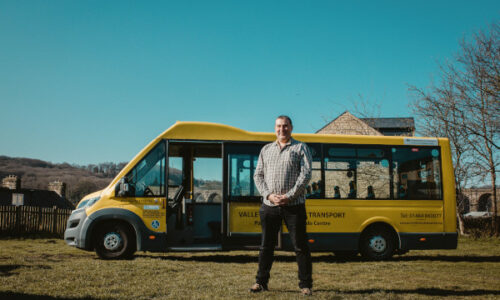 Denby Dale Centre, Paul Jones Mbe standing in front of the mini bus