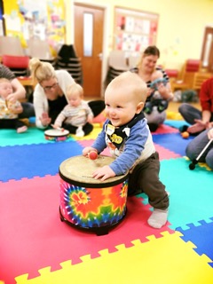 toddler on big drum