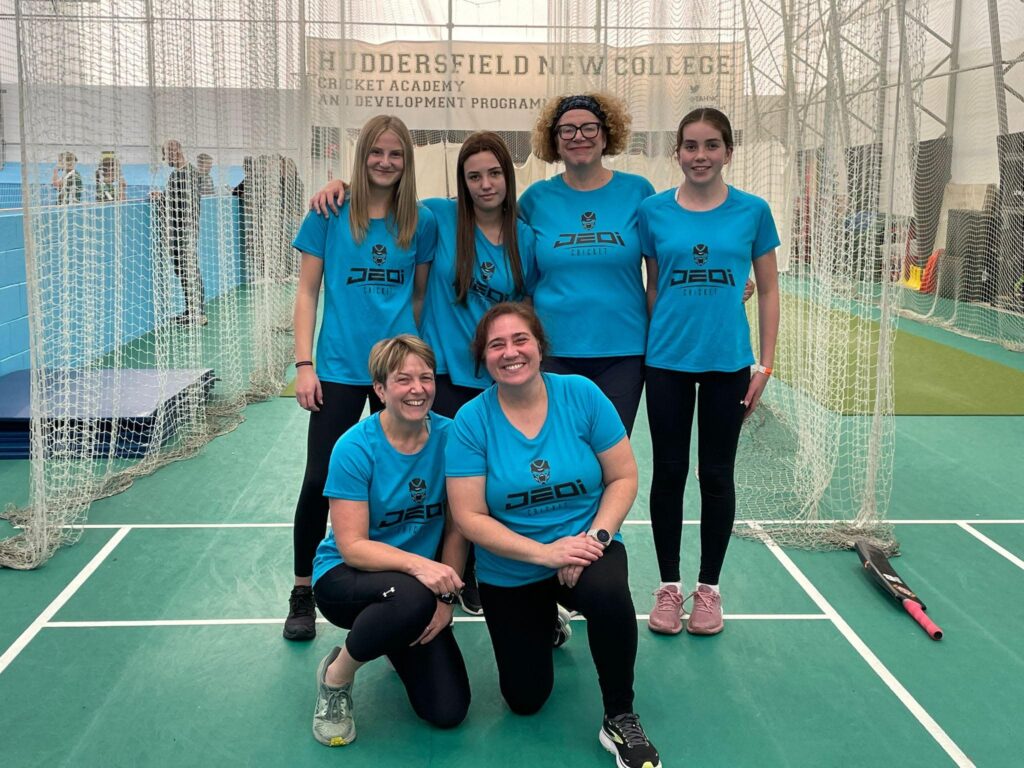 women playing winter indoor softball cricket